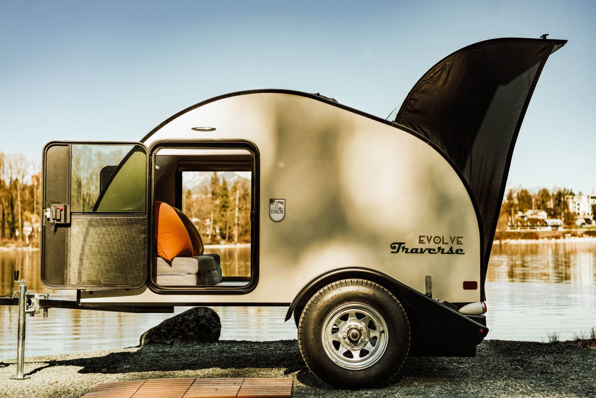 The ultralight and compact Evolve Traverse Solar Teardrop Trailer by the lake