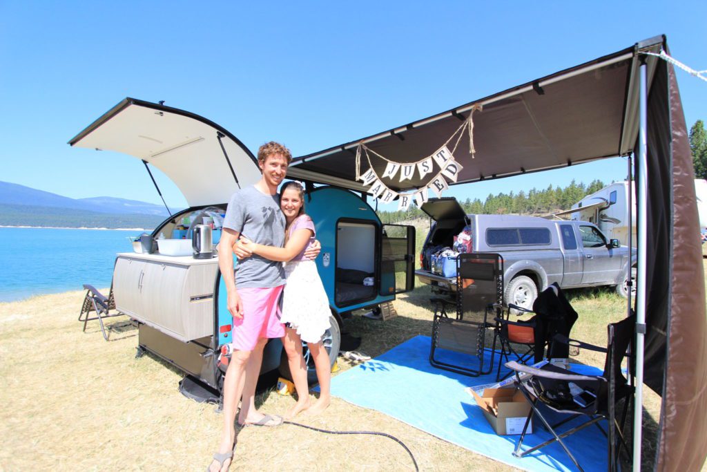 Honeymoon travels with The Evolve Solar Lightweight Teardrop Trailer set-up by the lake